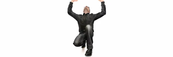 Man holding something heavy, on a white seamless background